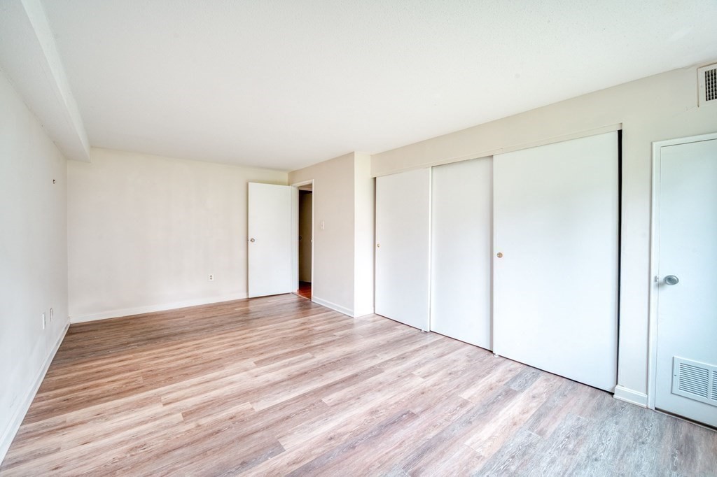 3 Post Oak Lane, Unit 4 Natick, MA 01760 - Photo 13 of 34 a view of an empty room with wooden floor