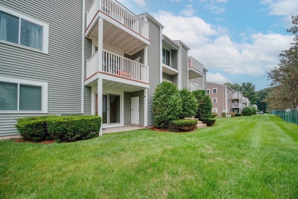 3 Post Oak Lane, Unit 4 Natick, MA 01760 - Photo 25 of 34 a view of a house with a yard and plants