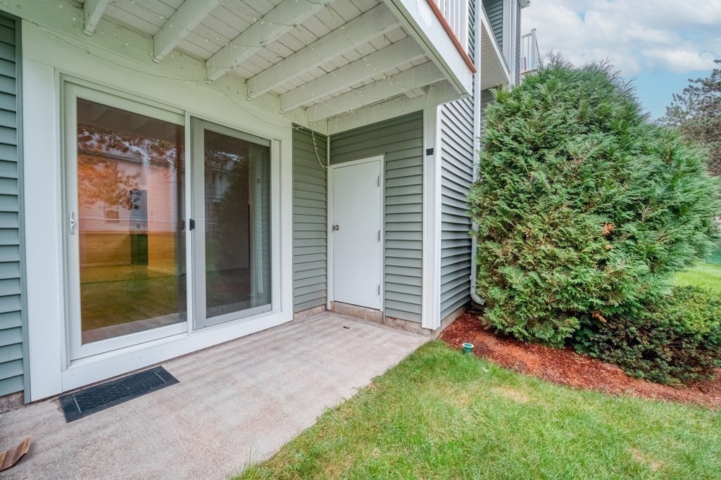 3 Post Oak Lane, Unit 4 Natick, MA 01760 - Photo 32 of 34 a view of yellow house with a yard and potted plants