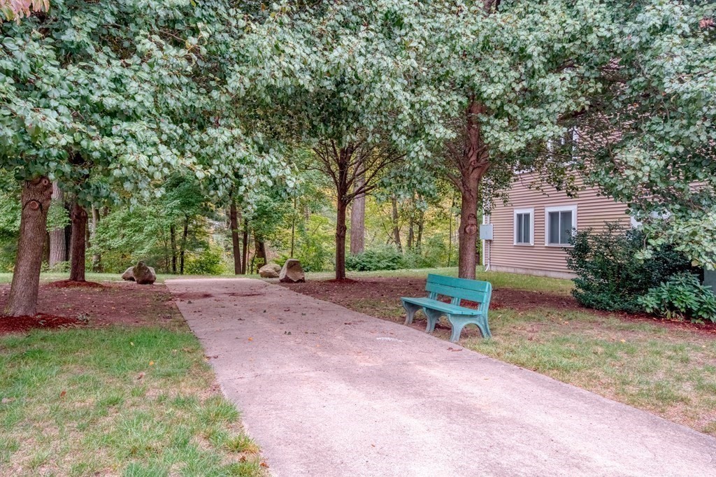 3 Post Oak Lane, Unit 4 Natick, MA 01760 - Photo 33 of 34 a backyard of a house with yard and outdoor seating