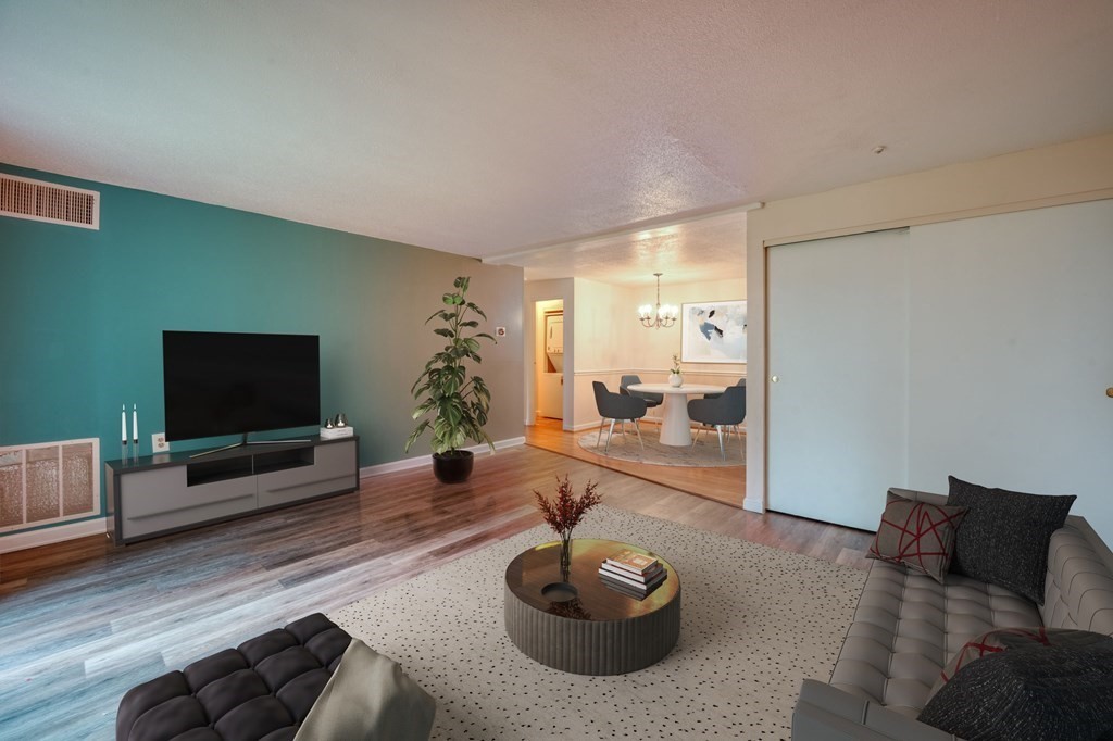 3 Post Oak Lane, Unit 4 Natick, MA 01760 - Photo 4 of 34 a living room with furniture and a flat screen tv
