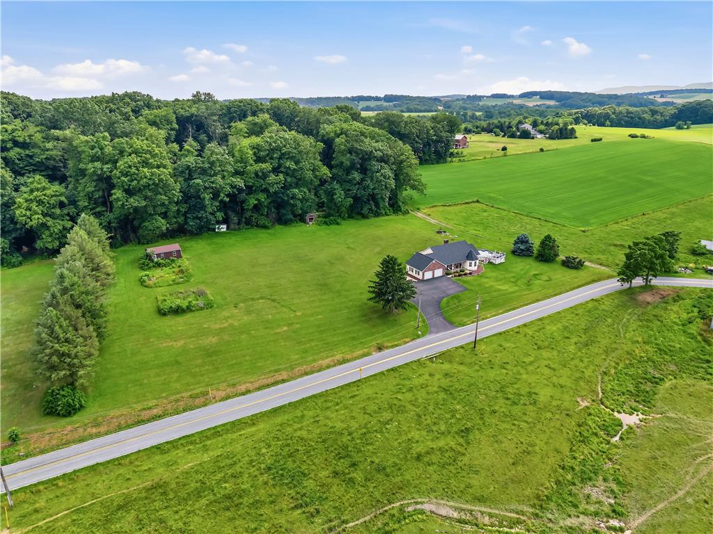 9868 Stagecoach Road Kempton, PA 19529 - Photo 3 of 17 Perched on an expansive lot, this charming residence offers picturesque rural views and direct road access.