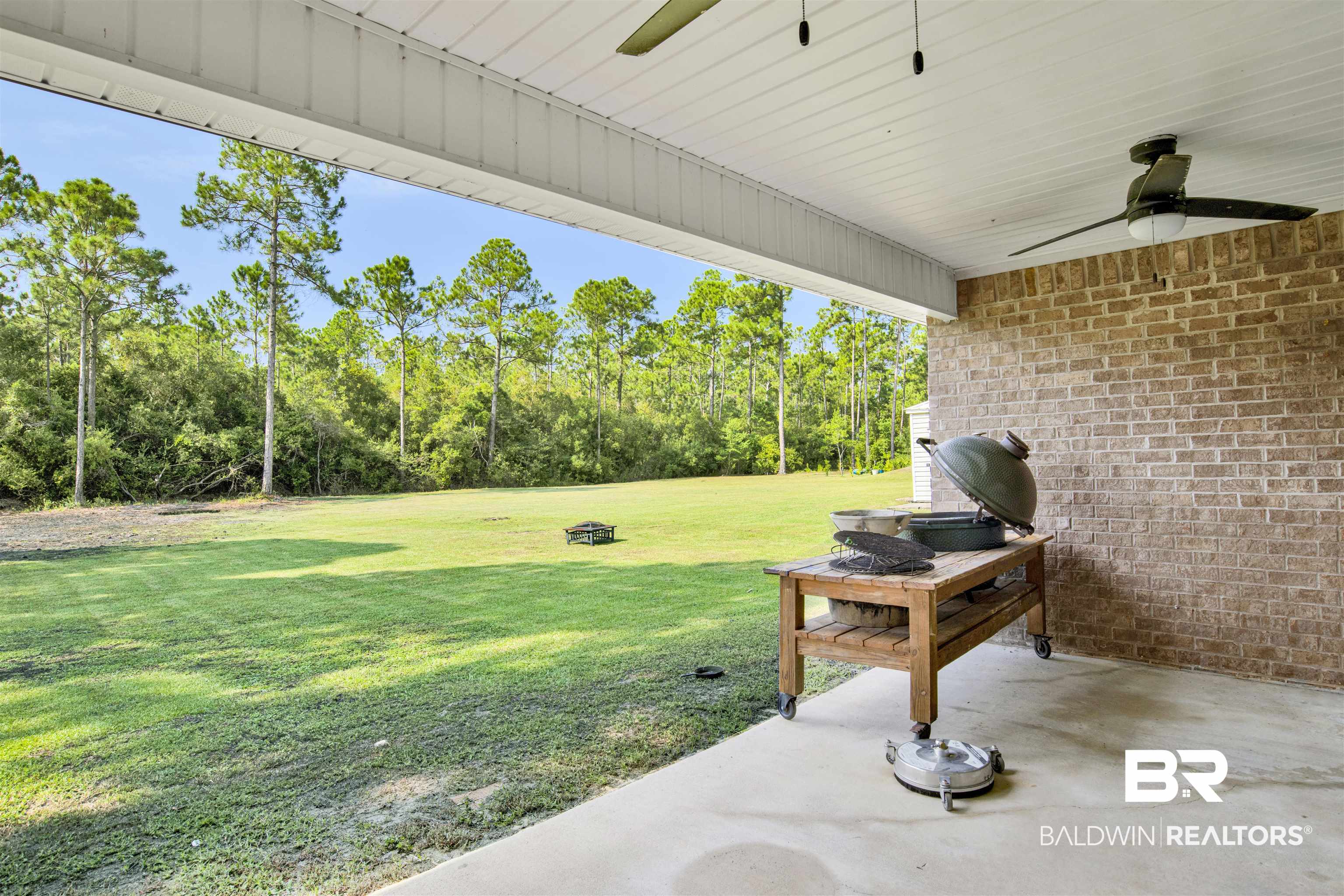 24384 Sailfish Lane Orange Beach, AL 36561 - Photo 18 of 23 View of yard featuring ceiling fan and a patio area