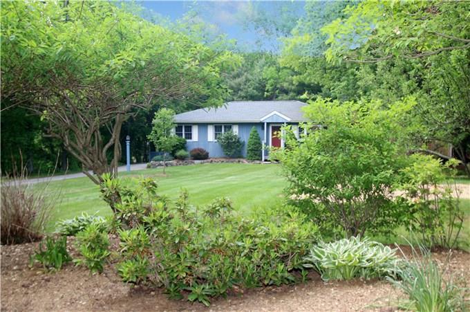4 Longview Road Newtown, CT 06482 - Photo 1 of 1 a view of a garden with a house in the background