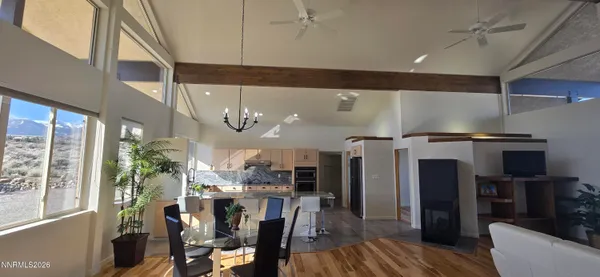 a kitchen with stainless steel appliances kitchen island granite countertop a refrigerator and a stove top oven