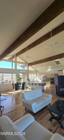 a view of a livingroom with furniture and window