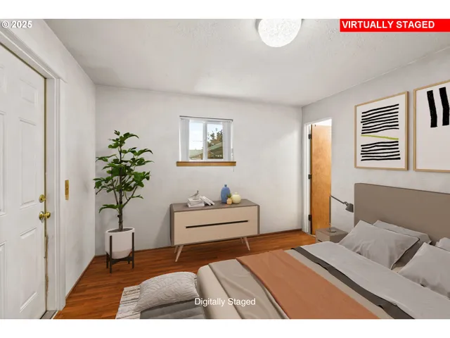 a bedroom with a bed and a potted plant