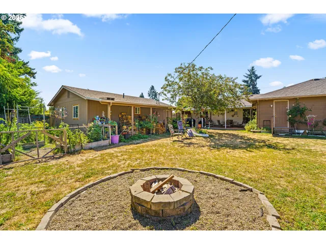 a swimming pool with outdoor seating and yard