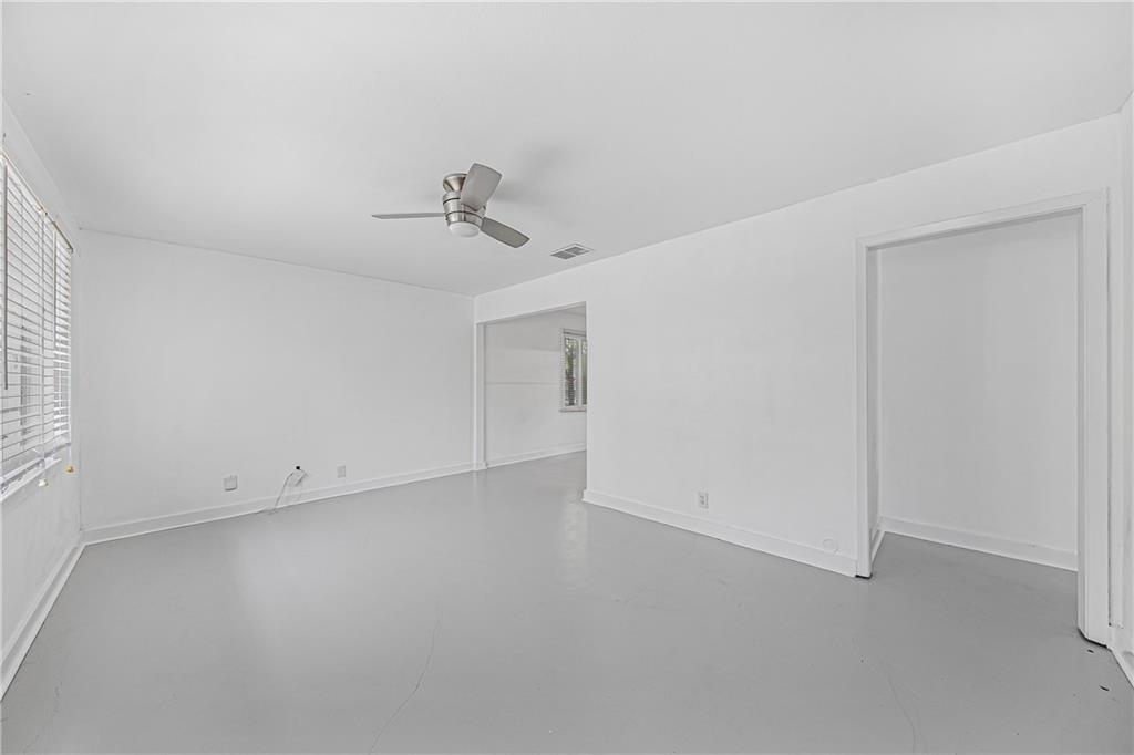 3705 Tower View Court Austin, TX 78723 - Photo 6 of 15 an empty room with a empty space and windows
