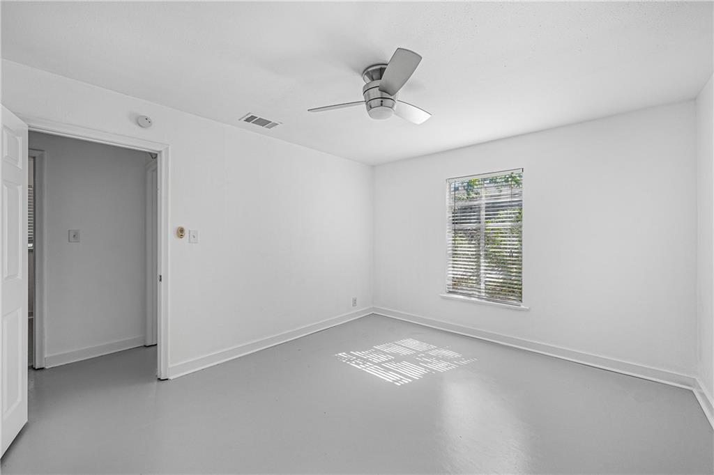 3705 Tower View Court Austin, TX 78723 - Photo 9 of 15 a view of empty room with wooden floor and fan