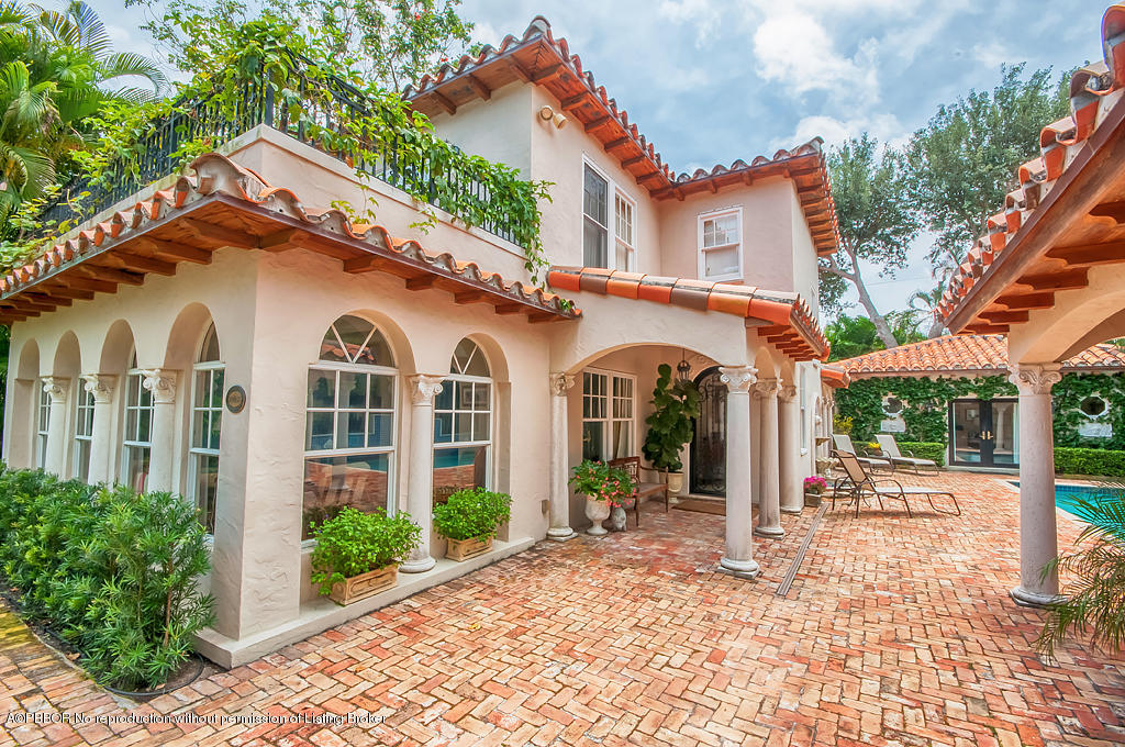 282 Barcelona Road West Palm Beach, FL 33401 - Photo 1 of 32 a view of a white house with a outdoor space