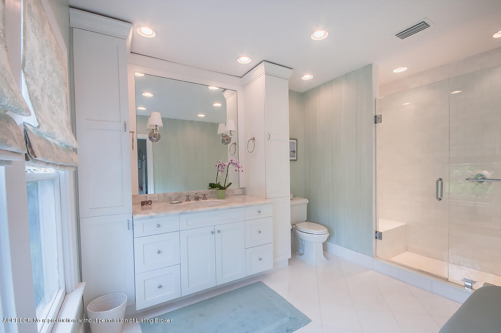 282 Barcelona Road West Palm Beach, FL 33401 - Photo 18 of 32 a bathroom with a double vanity sink toilet and shower