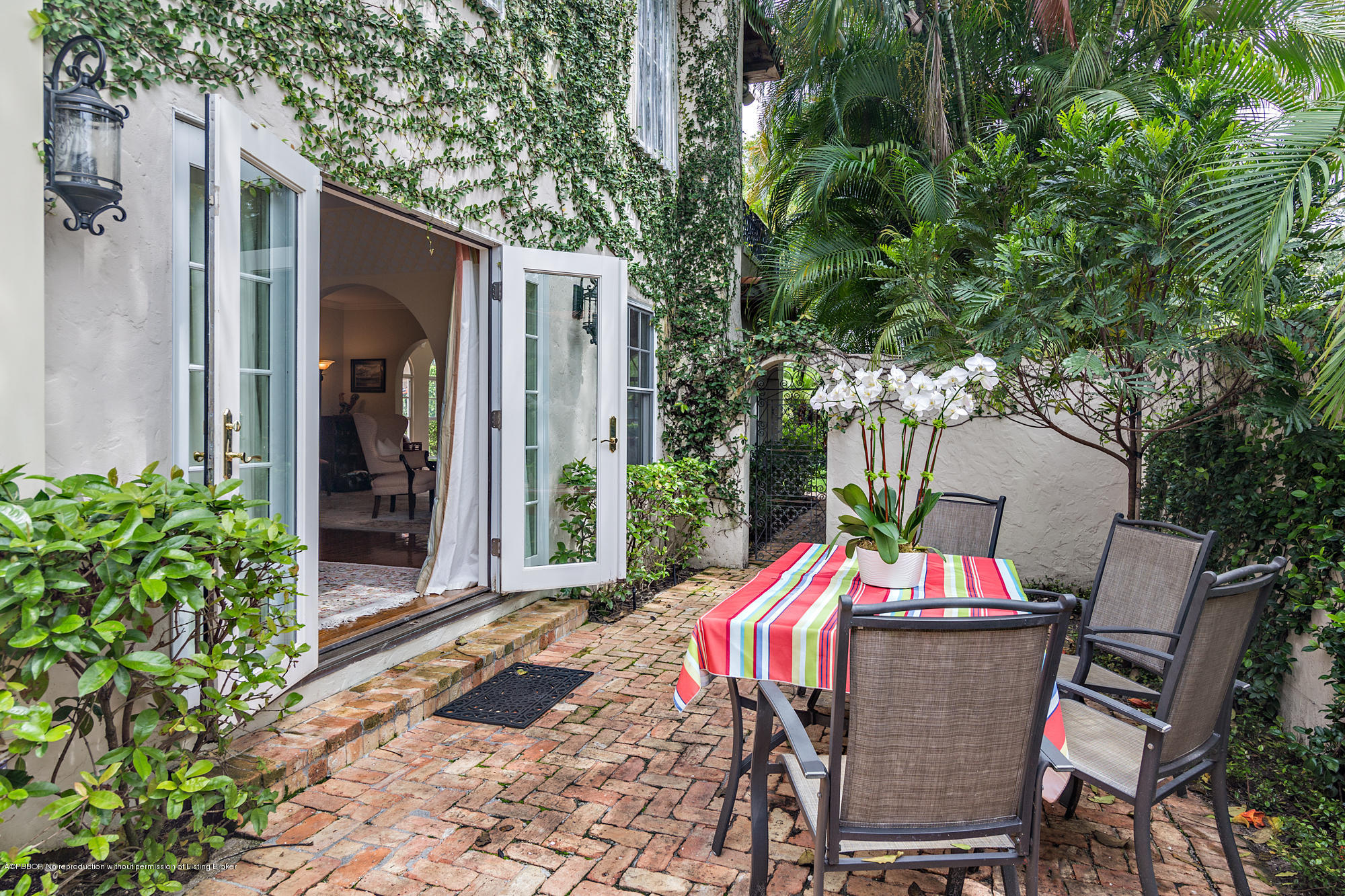 282 Barcelona Road West Palm Beach, FL 33401 - Photo 28 of 32 a view of a chairs and table in the patio