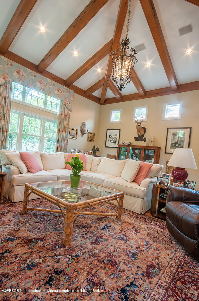 282 Barcelona Road West Palm Beach, FL 33401 - Photo 5 of 32 a living room with furniture and a chandelier