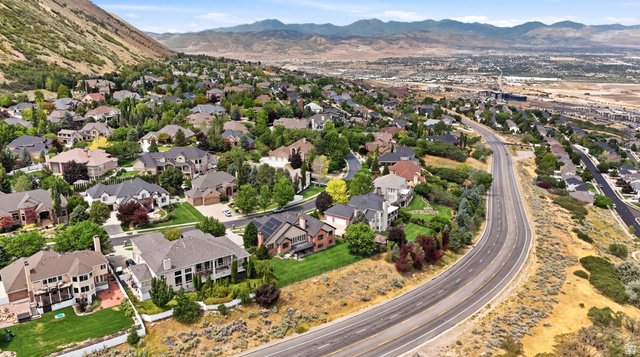 767 Draper View Road Draper, UT 84020 - Photo 68 of 71 Expansive residential area featuring numerous properties with varied architectural styles, mature landscaping, and an adjacent multi-lane paved road
