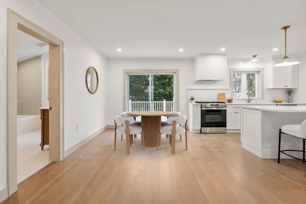 a view of a dining room with furniture window and wooden floor