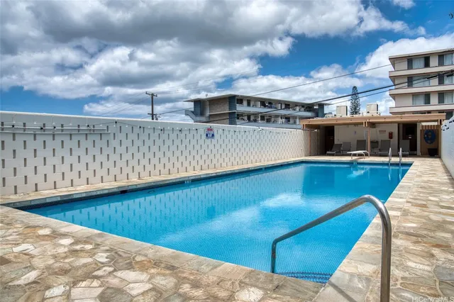 a view of roof deck with a barbeque and wooden stairs