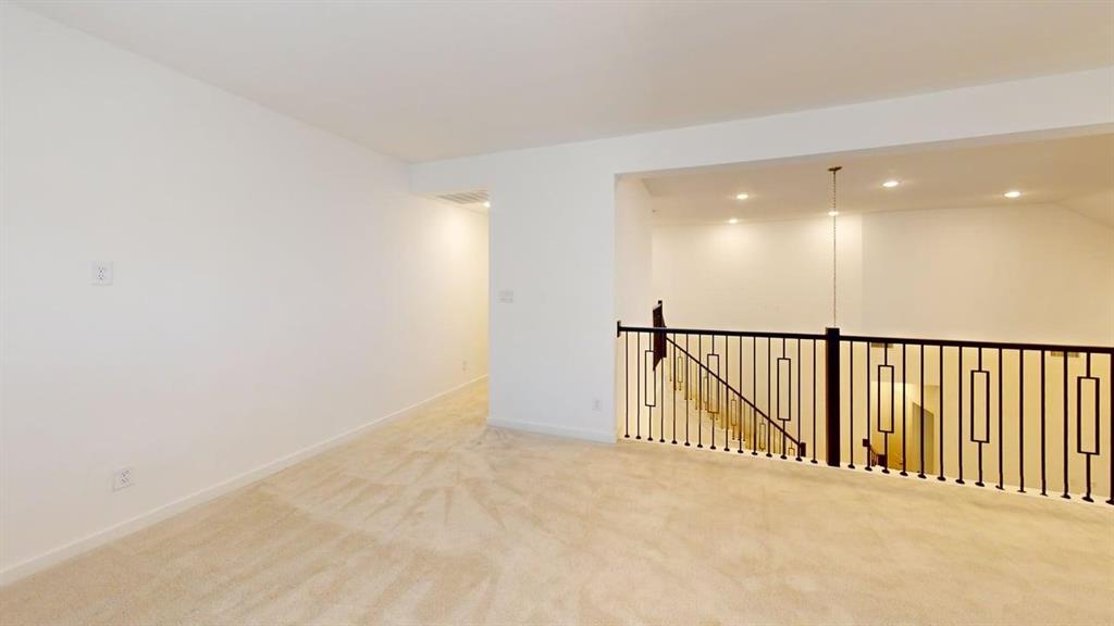 9628 Boulder Pt Road Oak Point, TX 75068 - Photo 7 of 35 Open loft area featuring neutral carpeting, recessed lighting, and a modern black metal baluster railing