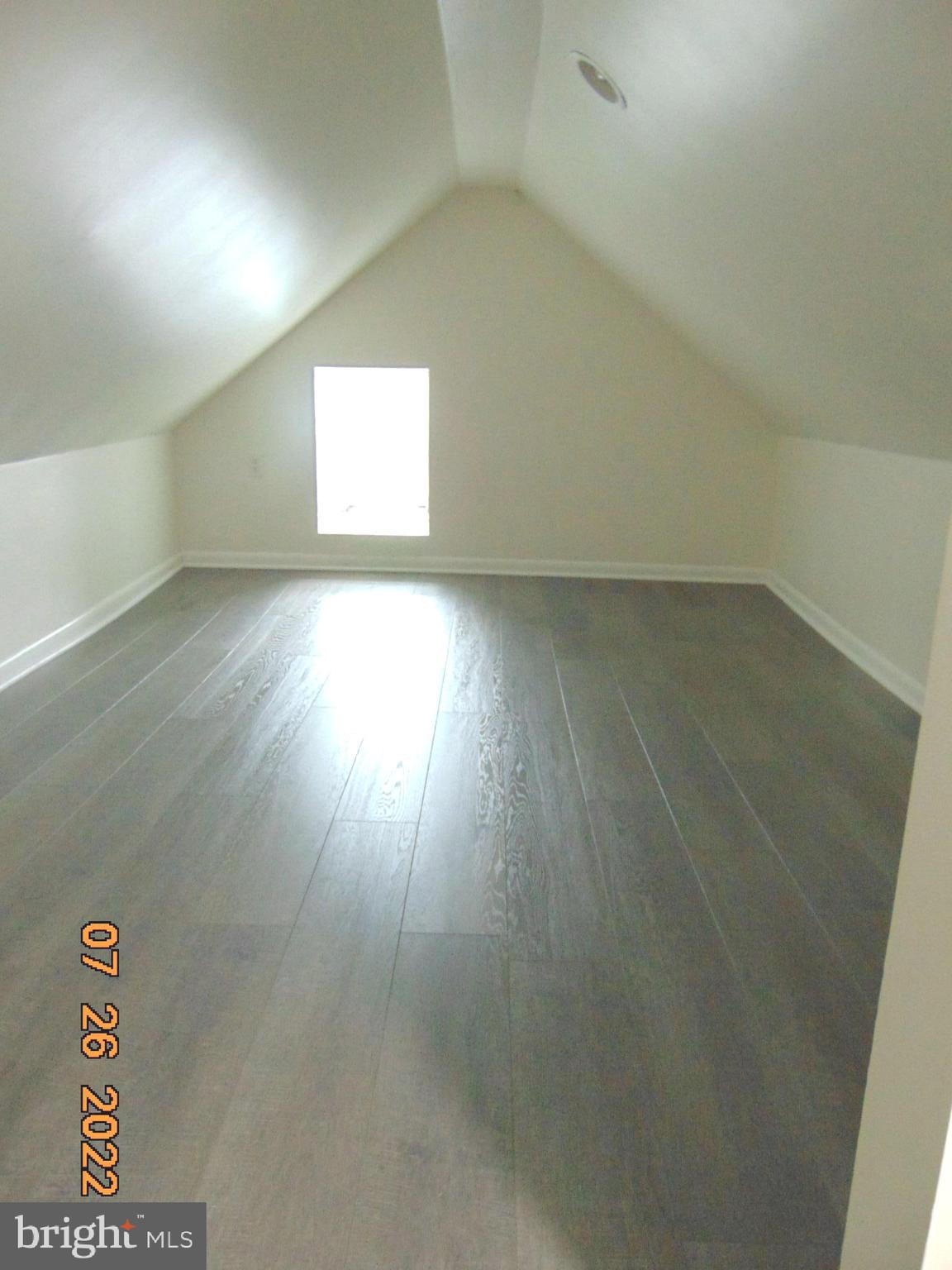 140 West South Street Frederick, MD 21701 - Photo 2 of 33 an empty room with wooden floor and windows