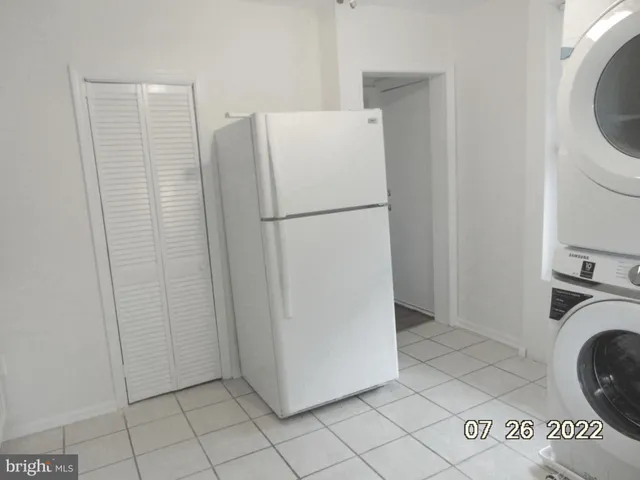 a view of a hallway with washer and dryer