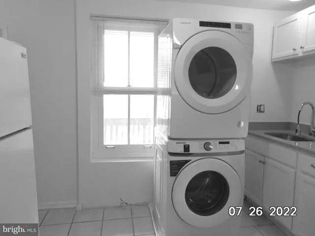 a kitchen with granite countertop a sink and a window