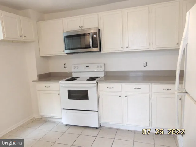 an empty room with a empty space and wooden floor