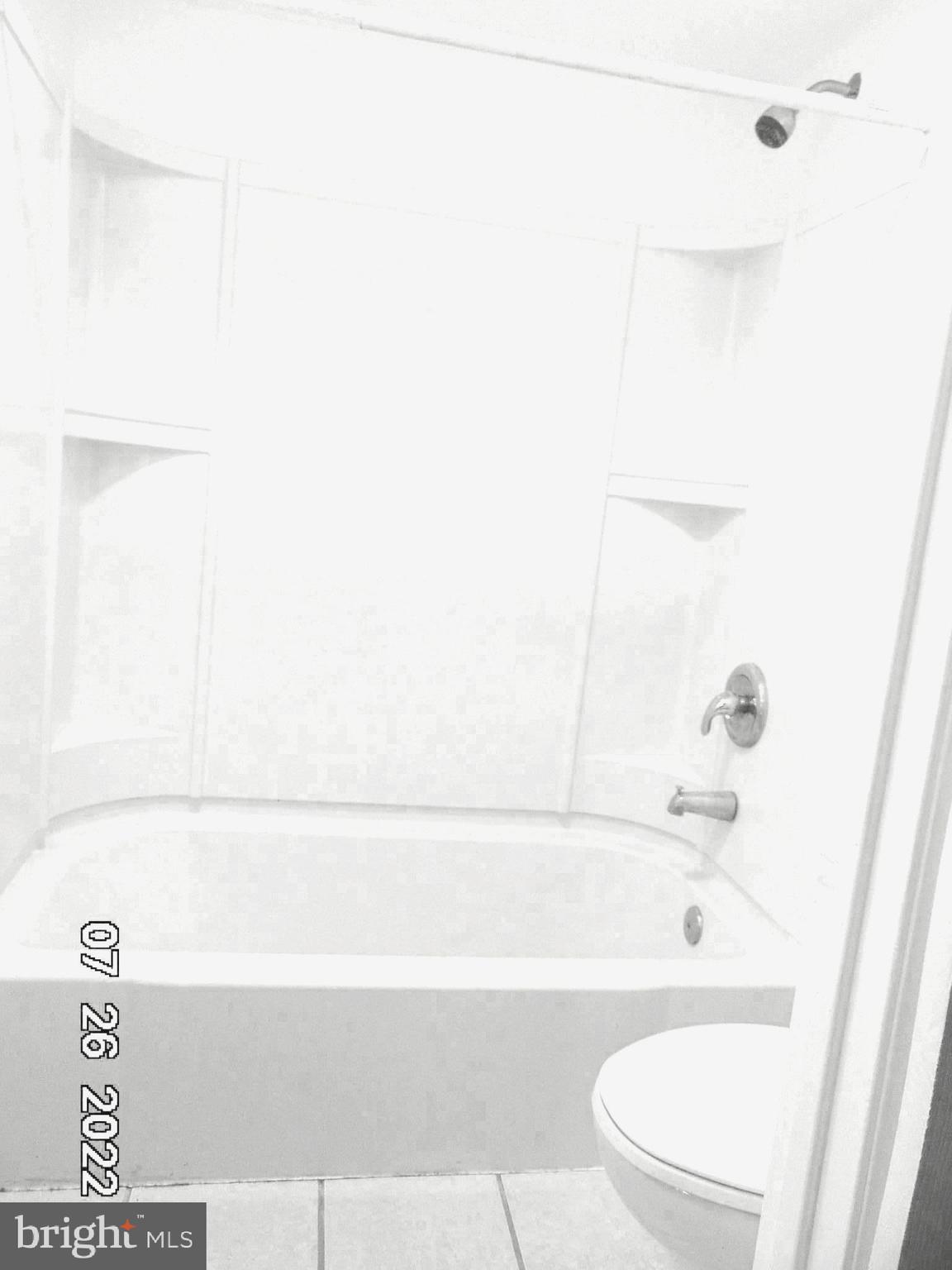 140 West South Street Frederick, MD 21701 - Photo 6 of 33 a bathroom with a bathtub and a toilet