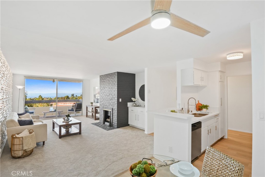 28121 Highridge Road, Unit 402 Rancho Palos Verdes, CA 90275 - Photo 11 of 38 a living room with furniture and a table
