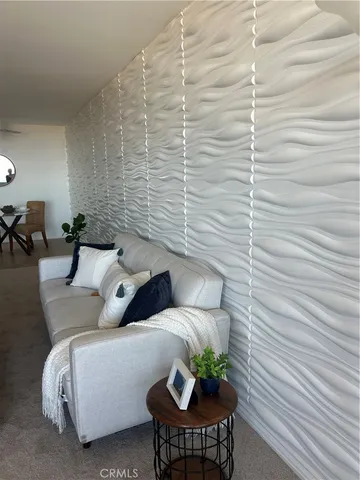 a living room with kitchen island furniture and a table
