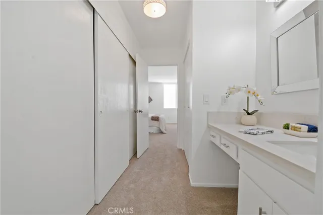 a bedroom with bed and a potted plant