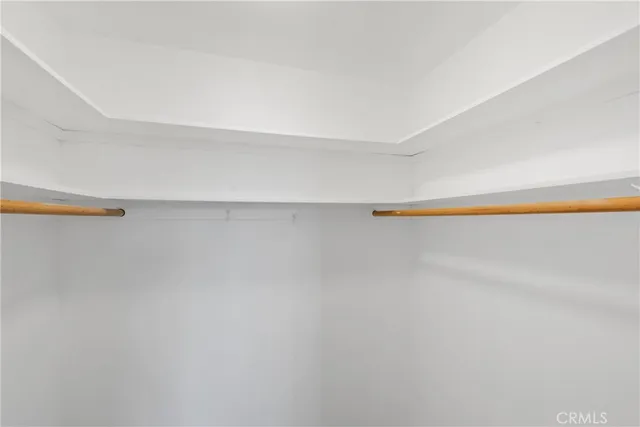 a bathroom with a granite countertop toilet sink and a mirror