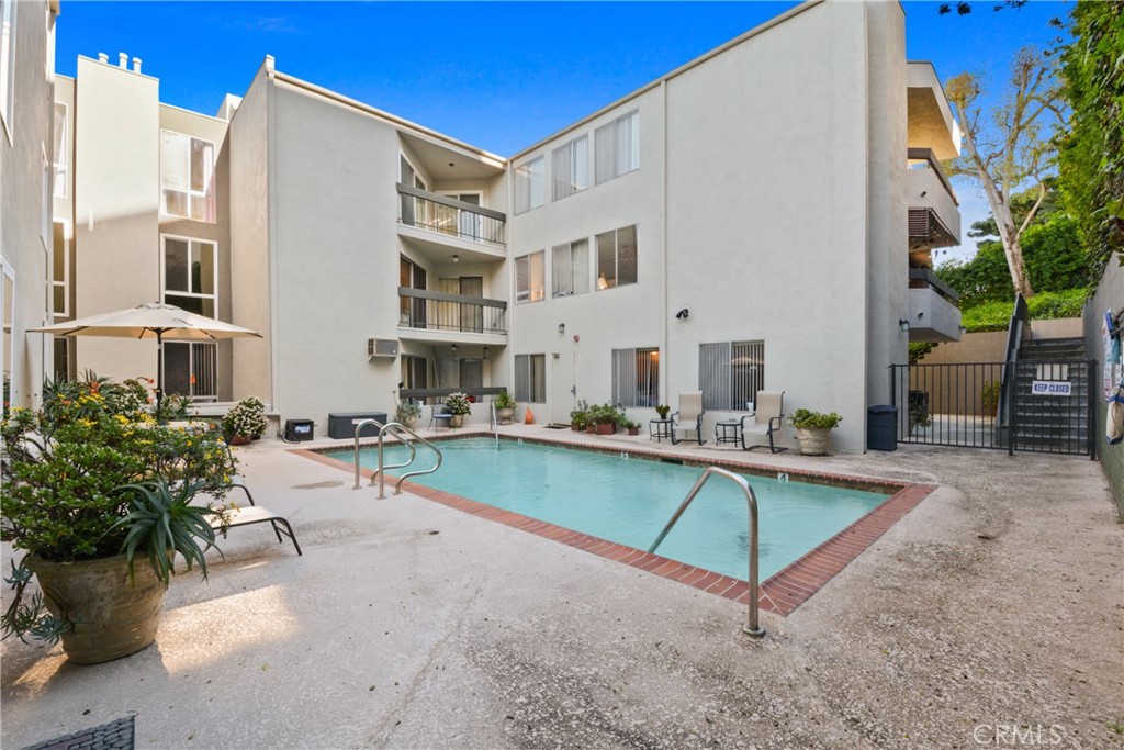 28121 Highridge Road, Unit 402 Rancho Palos Verdes, CA 90275 - Photo 26 of 38 a view of a house with swimming pool and sitting area