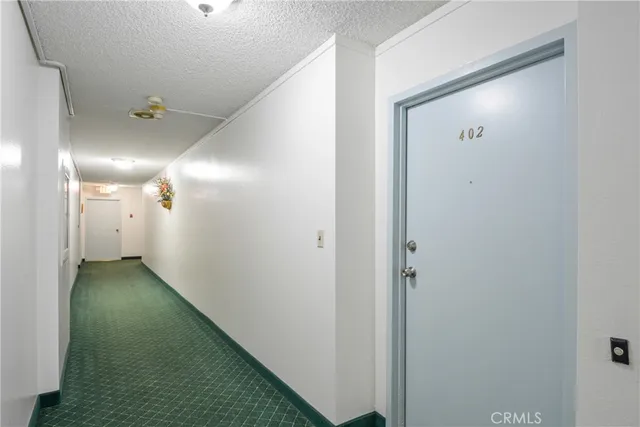 a view of a house with swimming pool and sitting area