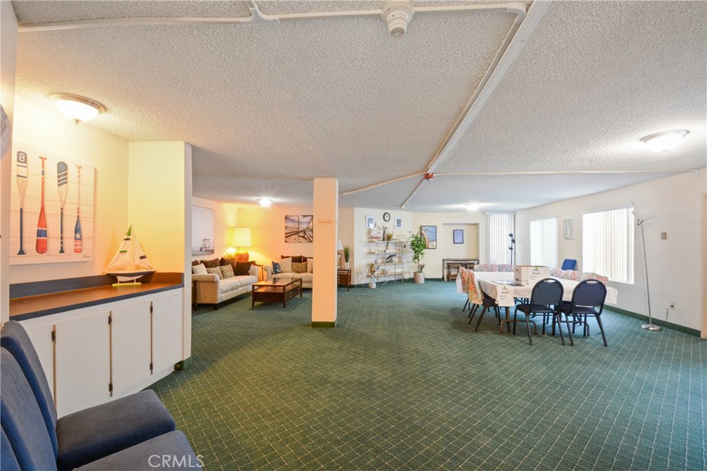 28121 Highridge Road, Unit 402 Rancho Palos Verdes, CA 90275 - Photo 27 of 38 a living room with lots of furniture and kitchen view