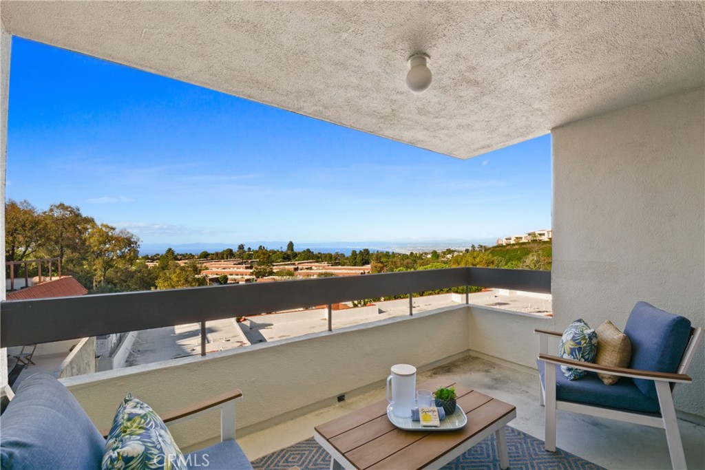 28121 Highridge Road, Unit 402 Rancho Palos Verdes, CA 90275 - Photo 8 of 38 a terrace with outdoor seating and city view