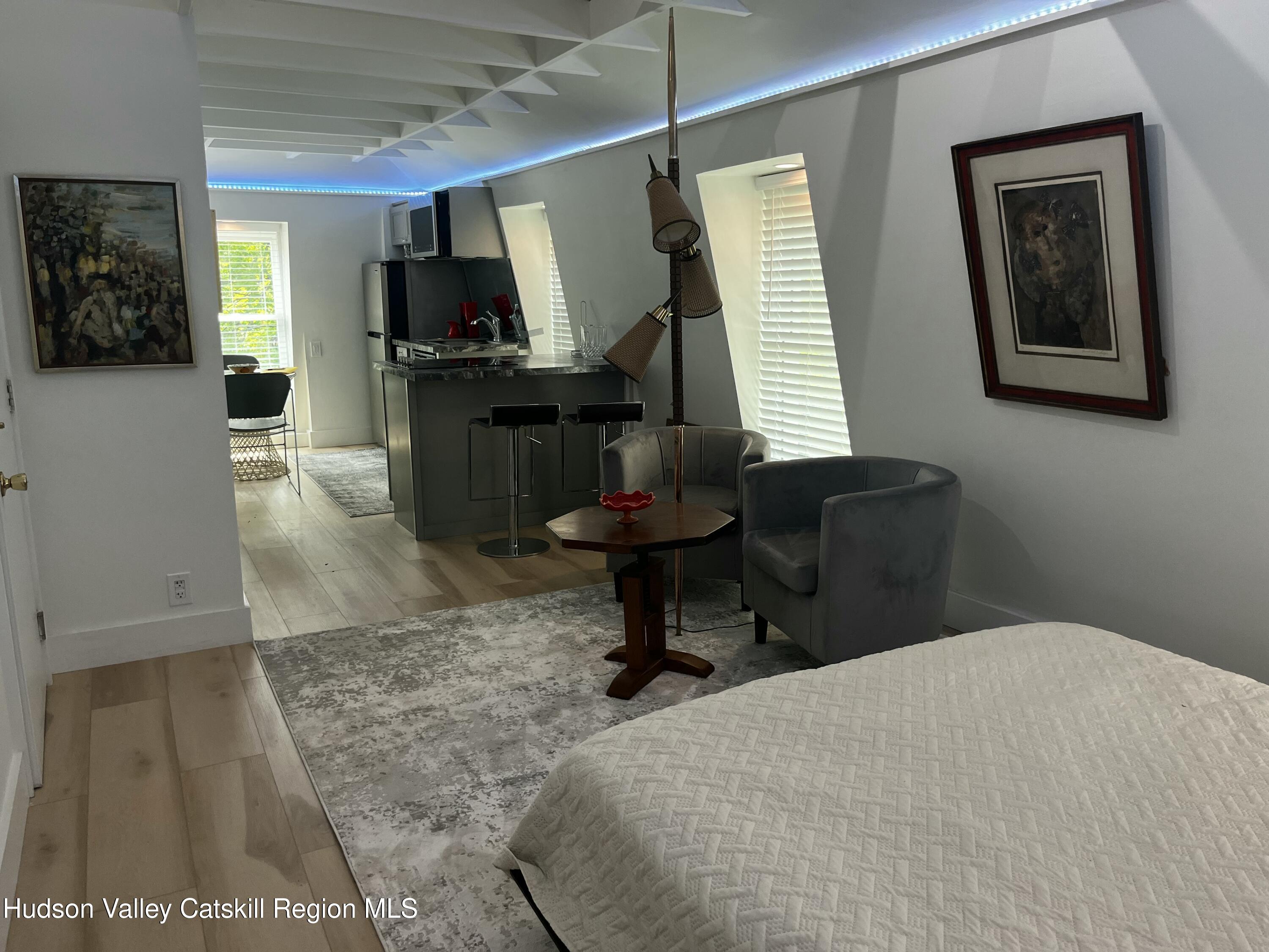 20 Tannery Brook Road, Unit 6 Woodstock, NY 12498 - Photo 4 of 12 a room with a bed and a mirror