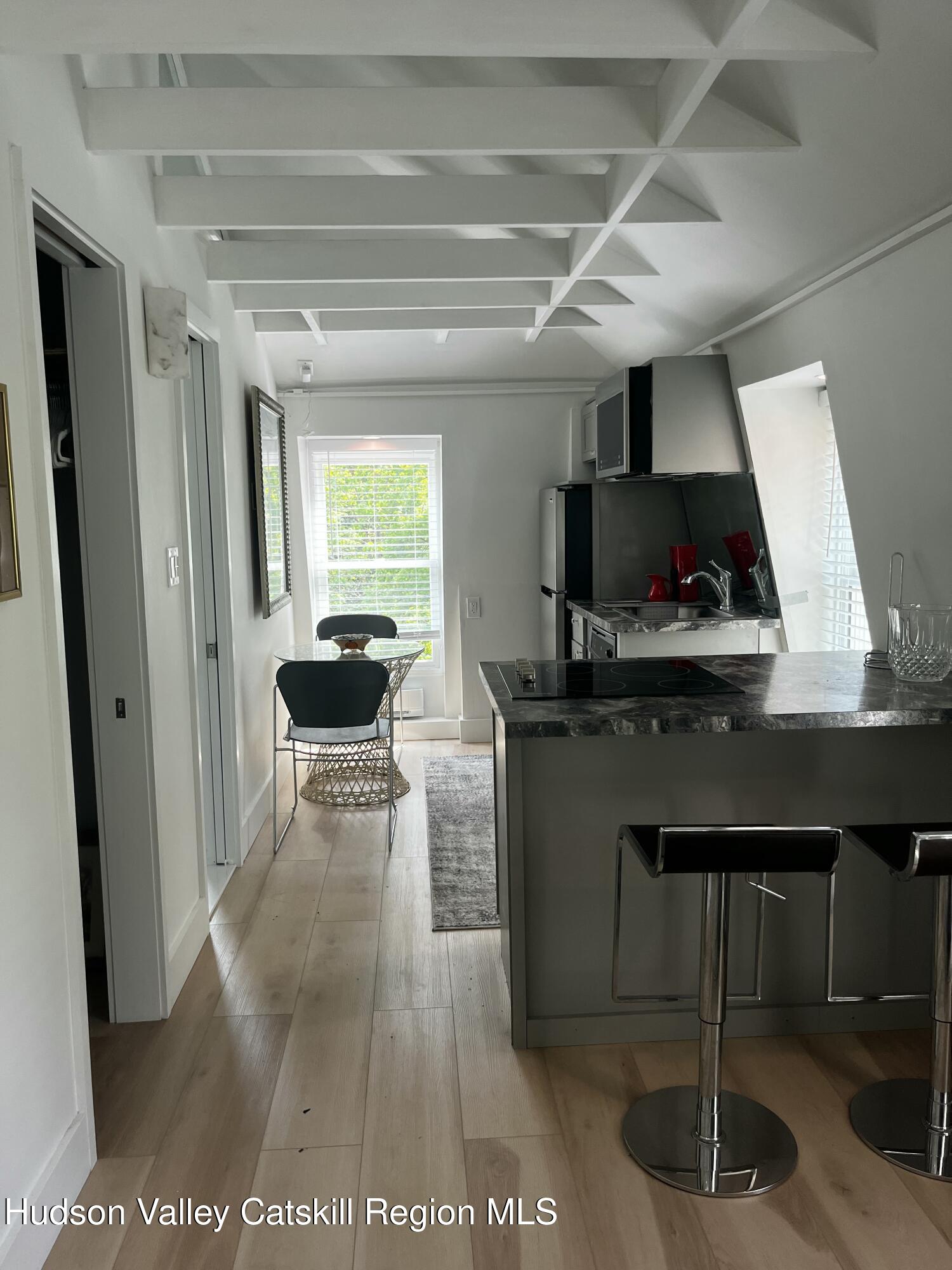 20 Tannery Brook Road, Unit 6 Woodstock, NY 12498 - Photo 5 of 12 a kitchen with a sink cabinets and window