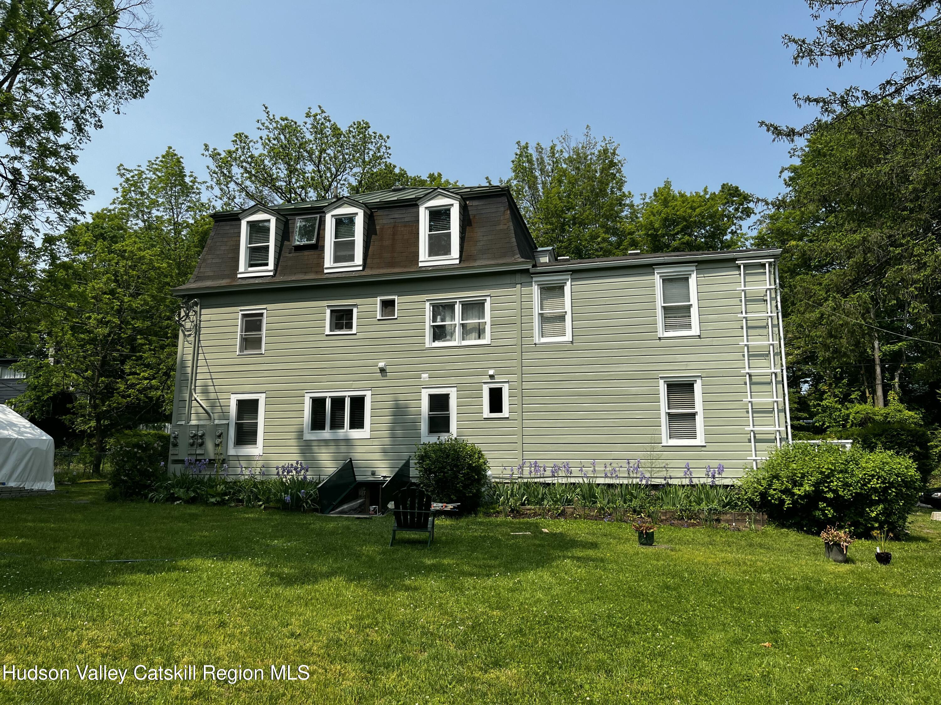 20 Tannery Brook Road, Unit 6 Woodstock, NY 12498 - Photo 10 of 12 a view of a house with a yard and potted plants