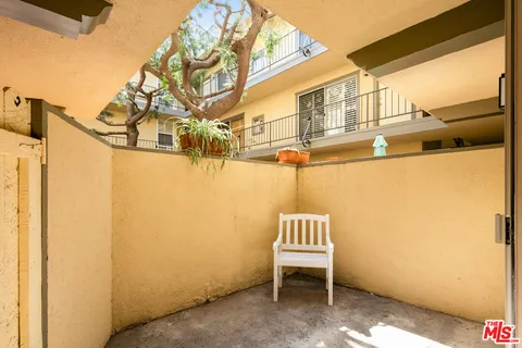 a view of a street with an outdoor seating