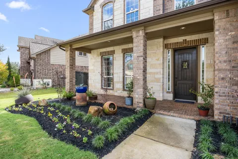 a front view of a house with garden