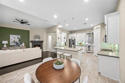 a living room with furniture fireplace and a flat screen tv