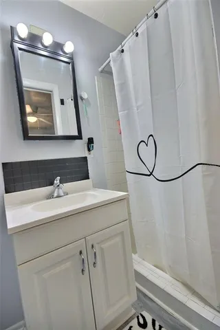 a bathroom with a sink and a mirror