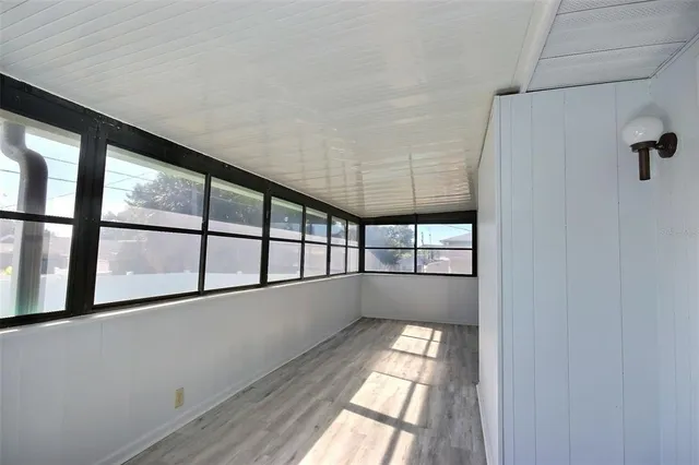 a view of empty room with windows