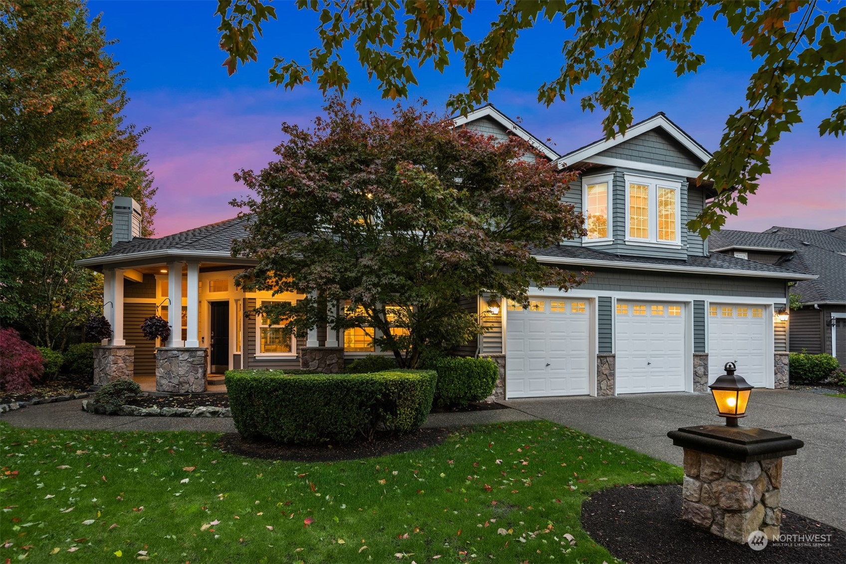2210 242nd Street Southeast Bothell, WA 98021 - Photo 1 of 40 a front view of a house with a garden