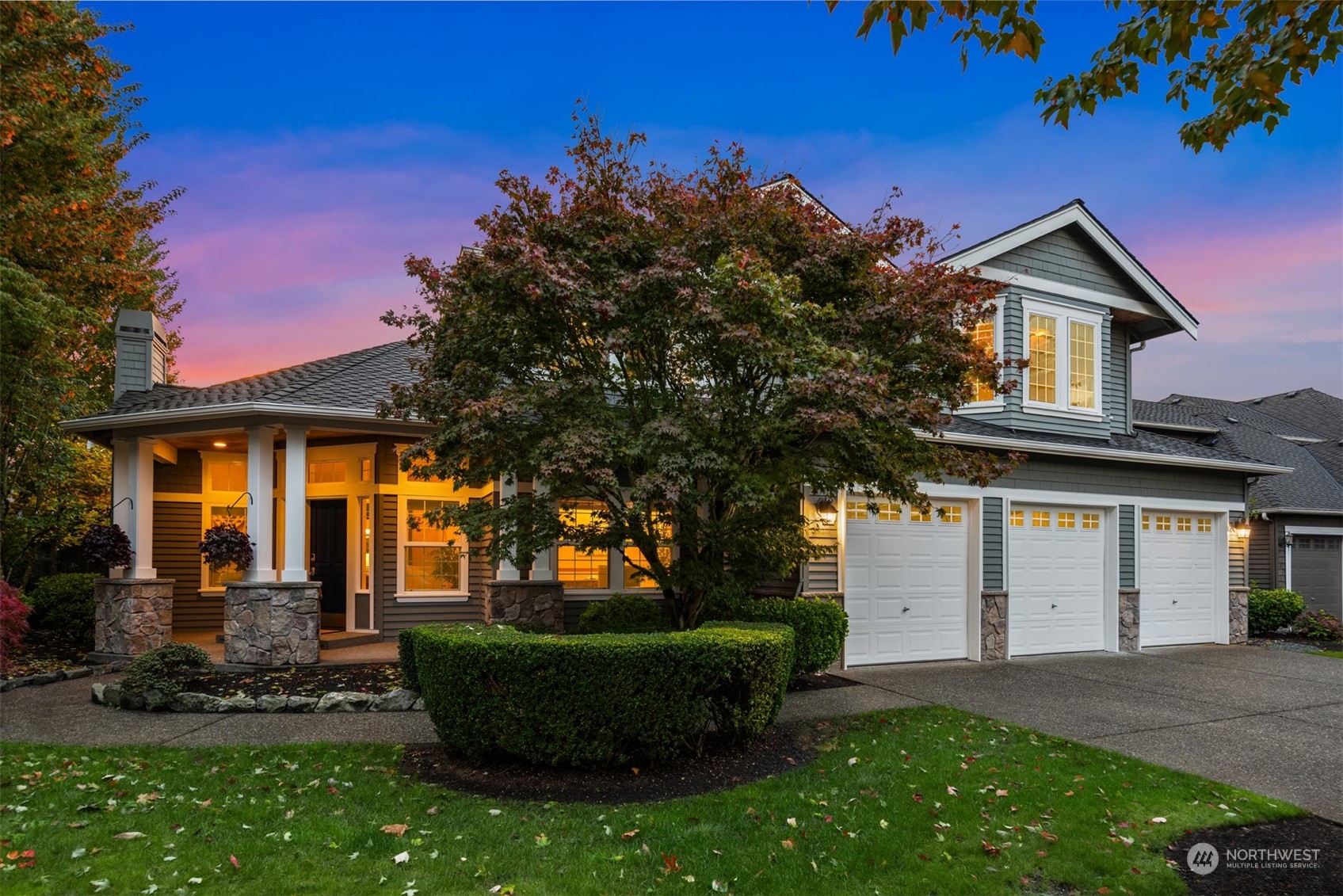 2210 242nd Street Southeast Bothell, WA 98021 - Photo 18 of 40 a front view of a house with a yard