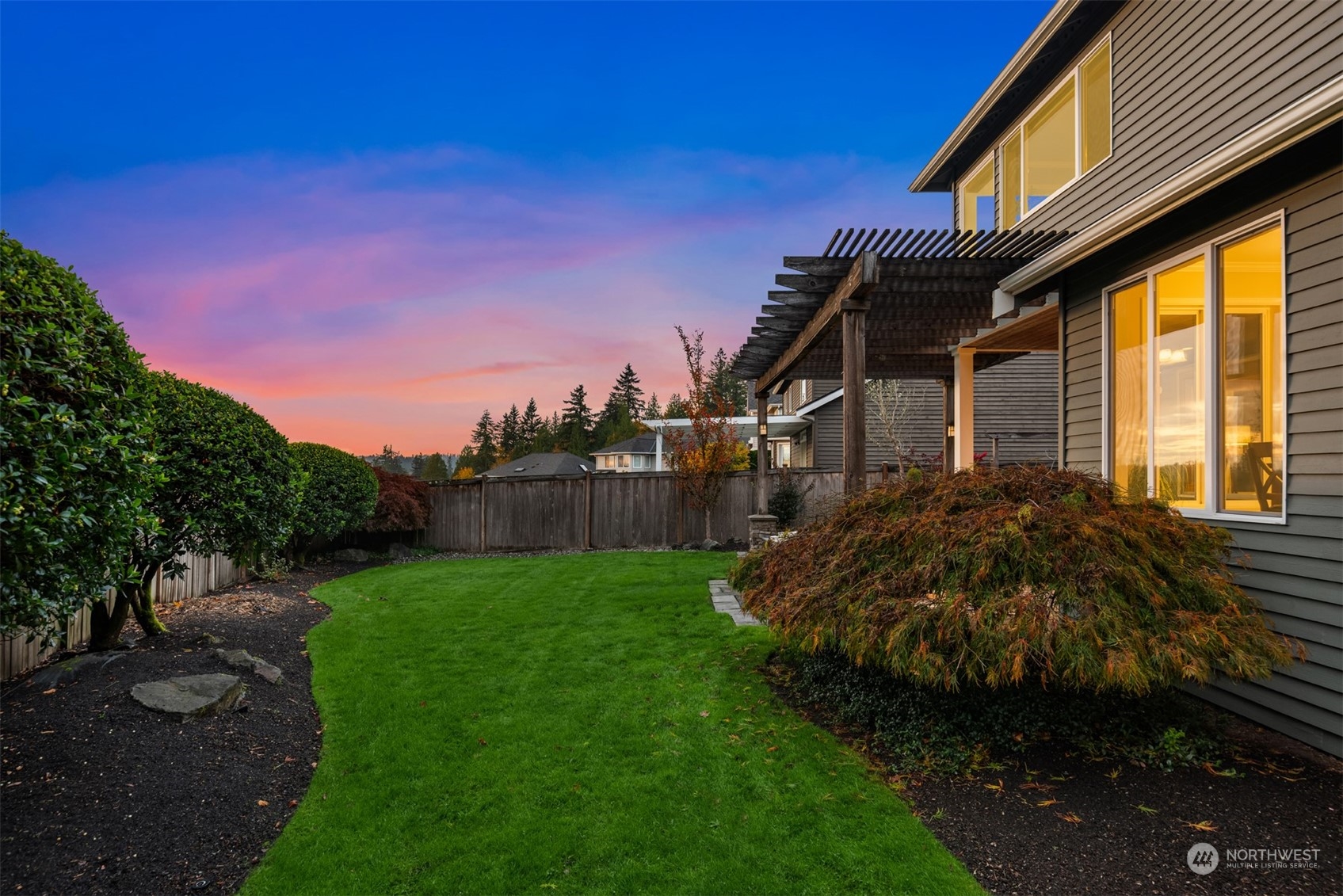 2210 242nd Street Southeast Bothell, WA 98021 - Photo 23 of 40 a view of a house with backyard and garden