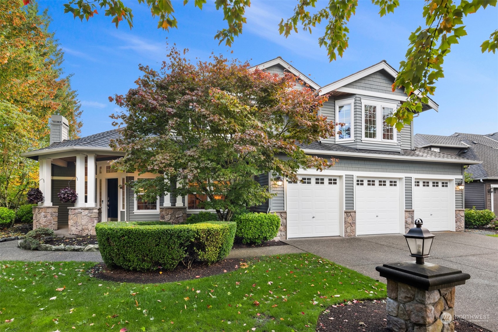 2210 242nd Street Southeast Bothell, WA 98021 - Photo 28 of 40 a front view of a house with a yard