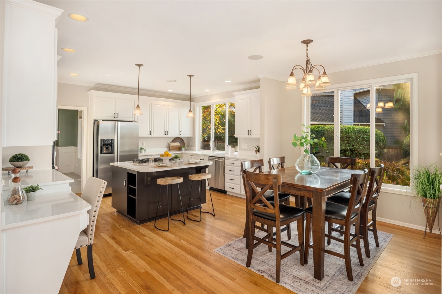 2210 242nd Street Southeast Bothell, WA 98021 - Photo 9 of 40 a large kitchen with a table and chairs