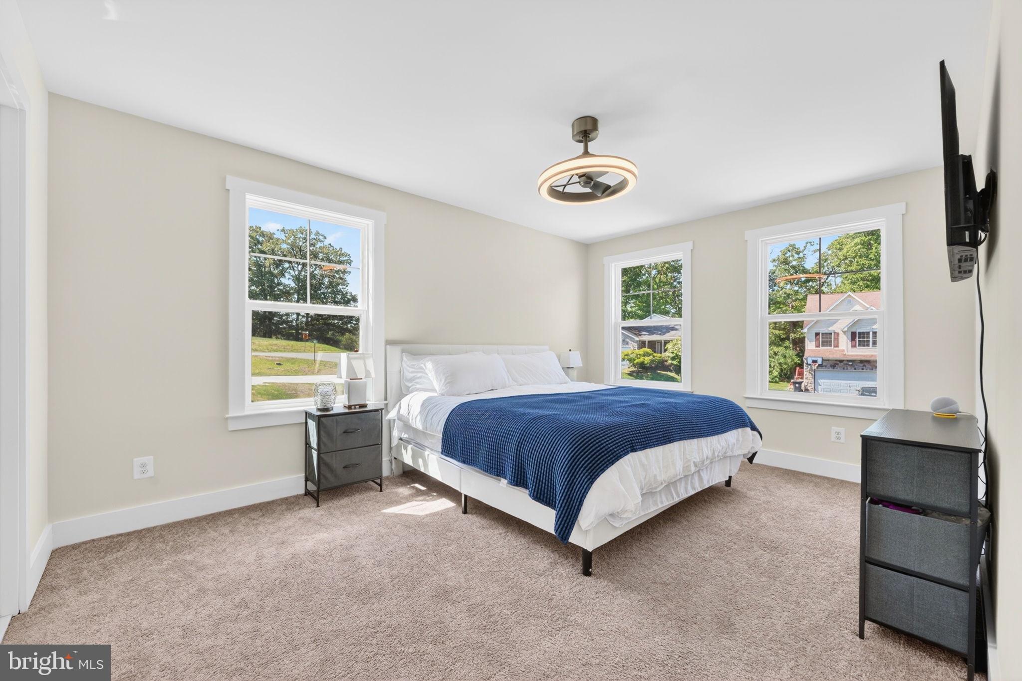 30 Range Road North East, MD 21901 - Photo 52 of 73 a spacious bedroom with a bed and a large window