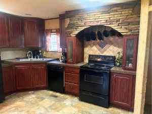 3669 East 25th Road Sheridan, IL 60551 - Photo 2 of 7 a kitchen with a stove and a sink